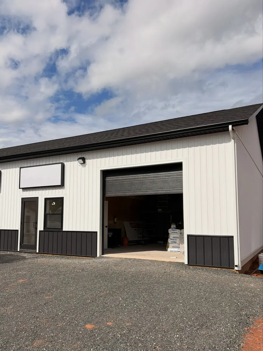 A commercial unit at Pooles Corner Plaza with its bay door open