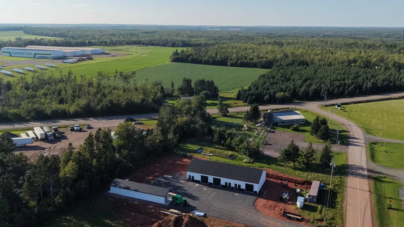 Aerial view of the Pooles Corner buildings among fields and woods